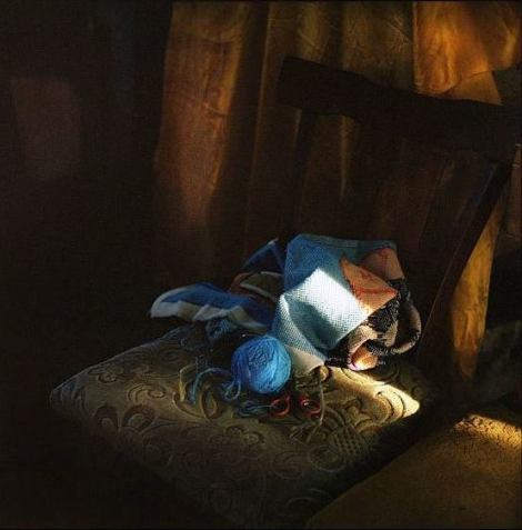 Knitting equipment of Galina Konyushok, a former liquidator of the Chernobyl nuclear accident, who is now living alone in her home in Zirka village. To keep herself busy, she occasionally knits making traditional folk patterns and religious images. Chernobyl, Ukraine. December 2010.